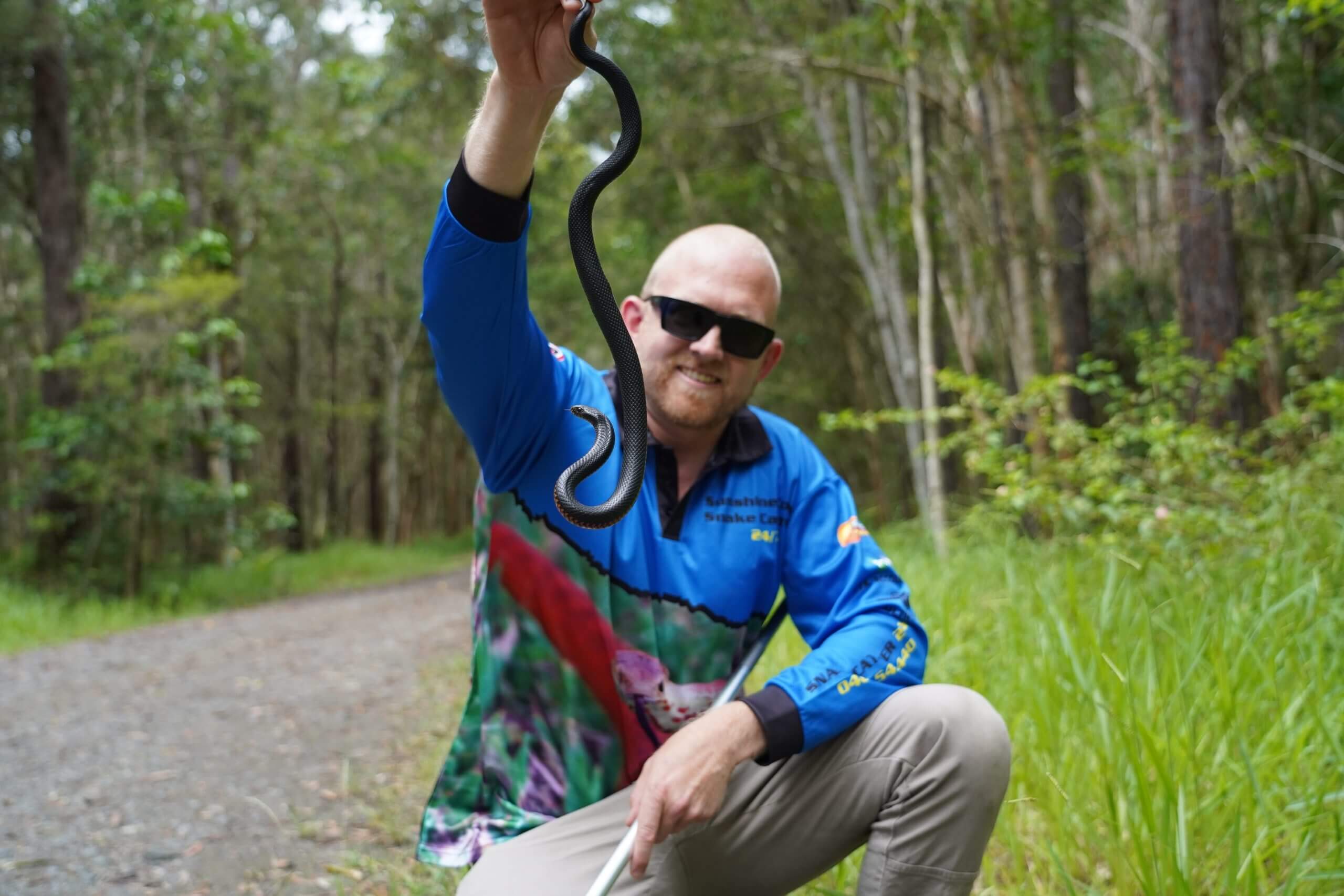 Stuart Holding Red Bellied Black Snake outside