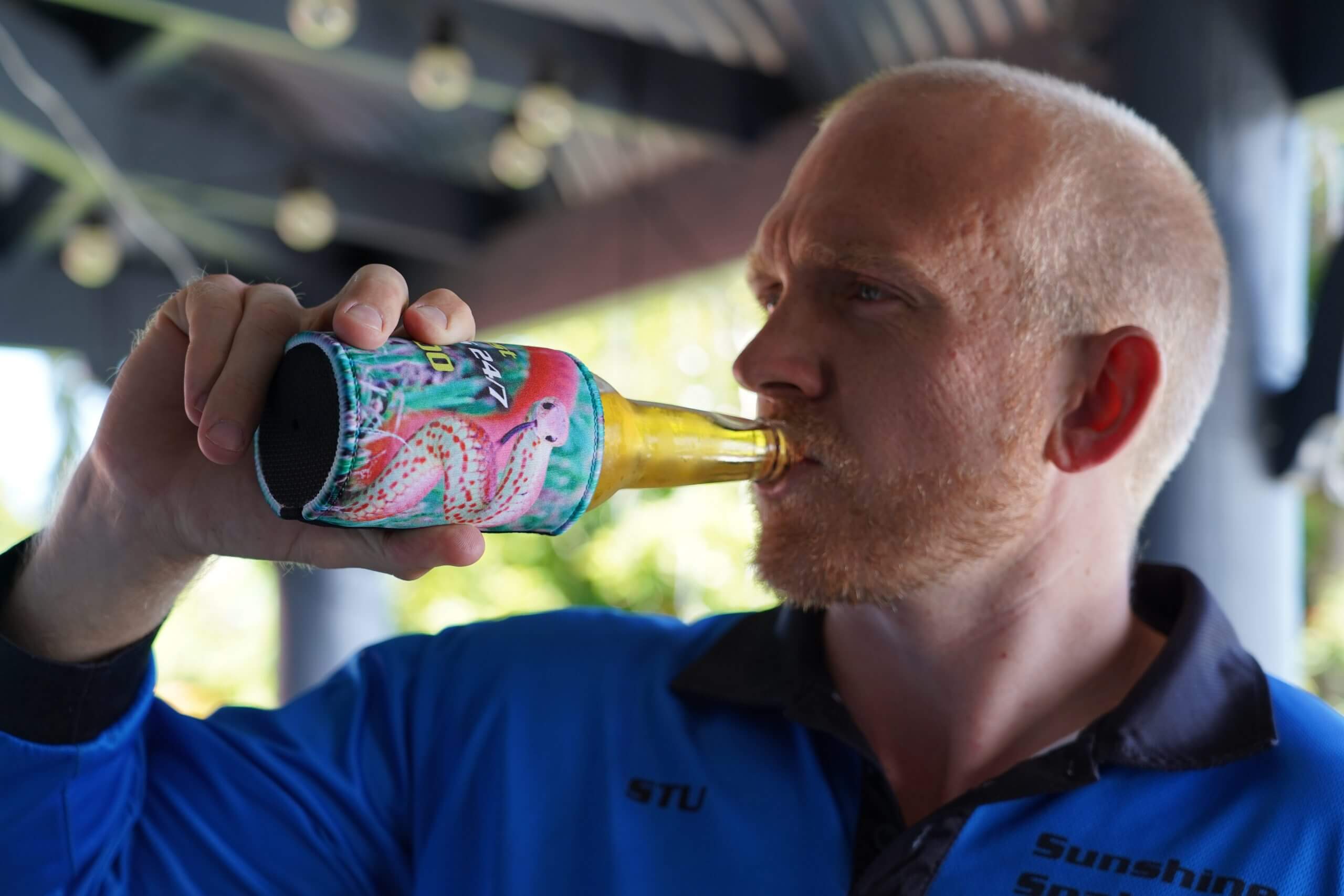 Stuart drinking a beer using stubby cooler